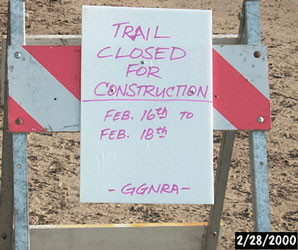 BEGINNING OF IMAGE DESCRIPTION.  IMAGE IS A PHOTOGRAPH OF A SMALL SAWHORSE WHICH HOLDS A HAND WRITTEN SIGN.  THE SIGN READS AS FOLLOWS. QUOTE, TRAIL CLOSED FOR CONSTRUCTION, FEBRUARY S16TH TO FEBRUARY 18TH. END QUOTE.  IN THE LOWER RIGHT CORNER OF THE PHOTOGRAPH IS A DATE STAMPED ON BY THE CAMERA.  THE DATE READS AS FOLLOWS, QUOTE, FEBRUARY 28TH, 2000. END QUOTE. END OF IMAGE DESCRIPTION.